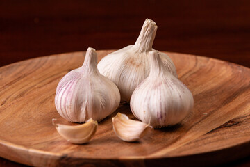 garlic on a wooden plate