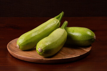 zucchini on a wooden plate