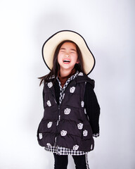 Asian little girl wearing a straw hat on white background