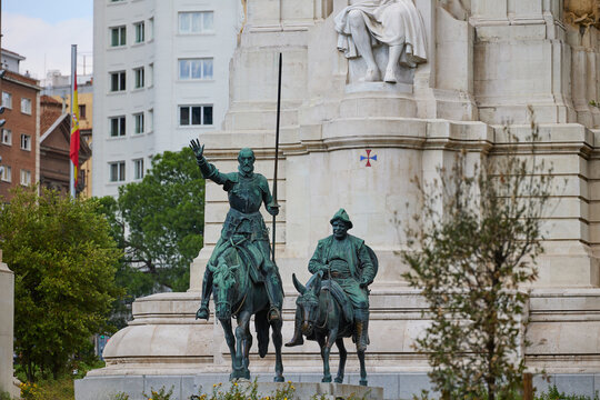 The monument of Miguel Cervantes on Plaza de Espana. Famous fictional knight, Don Quixote and Sancho Pansa from Cervantes' story. Madrid, Spain - June 12, 2024.