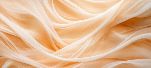 Fototapeta premium Peachy Smooth Abstract Fabric Texture: A close-up of a luxurious, peach-colored fabric, displaying soft, undulating folds and a silky, smooth texture. Perfect for adding a touch of elegance and sophis