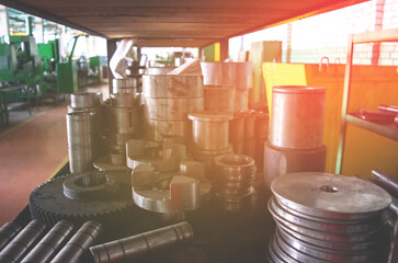 Metal billet for the production of gears on a threading machine for automobile gearboxes for trucks. Worksshop of the automotive factory.  Small roughness sharpness, possible granularity