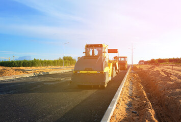 Asphalting paving repairing works. Vibrator compactor machine on roadworks on city street. Asphalt road roller on road construction. Road Construction Equipment. Vibration roller on Asphalting.