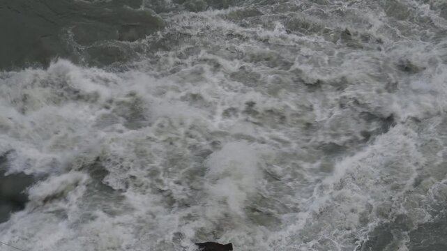 Bypass canal releasing excess water into Ravi River during monsoon in Chamba, Himachal Pradesh, India.