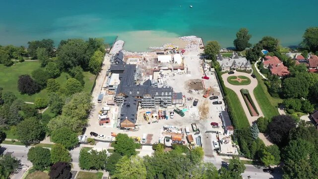 Phoenix Suns co-owner Justin Ishbia builds a 68,000 sq. ft. home for $44 million along the shores of Lake Michigan in Winnetka, IL amid controversy regarding beach access and a land swap.