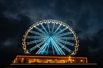 Night landscape, Ferris wheel with beautiful illumination at night. Attraction in Bukovel.