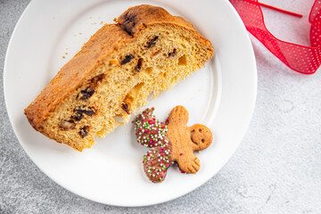 Panettone christmas cake baked sweet goods Christmas background New Year's holiday meal food snack on the table copy space food background rustic top view