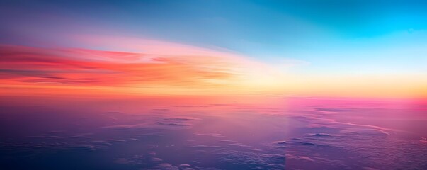 Obraz premium Aerial View of Sunset Over a Sea of Clouds