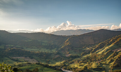 Expansive Mountain Valley View with Rolling Hills and Cloudy Sky, Nature and Tranquility Concept, Scenic Countryside Landscape at Sunset