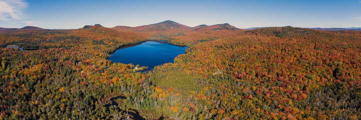 Aerial Panorama of Remote New England Pond During Fall Foliage Season - Bald Hill Pond - Westmore, Vermont, USA