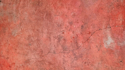texture of bright red old cracked dirty concrete wall for background in natural color tone. rustic background. bare concrete wall texture with blank space for design.