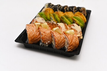 different sushi rolls on a white background