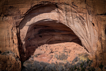 Stunning view of ancient Betatakin cliff dwellings located within Navajo National Monument in Arizona. The image highlights the impressive rock formations and historic significance of the site - USA