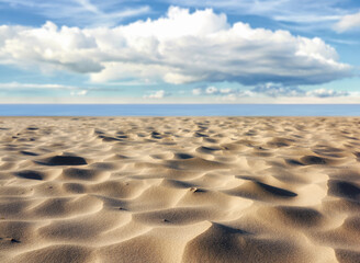 Natural, sand ripples and beach with vacation, clouds and travel with tourism, adventure and texture. Empty, landscape and seaside with summer, holiday and outdoor with blue sky and environment