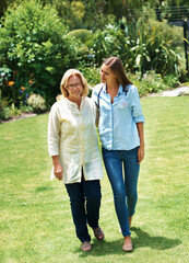 Assisted living, garden or walking with nurse and old woman outdoor on lawn together for mobility exercise. Conversation, healthcare or medical with caregiver and senior patient on grass for fitness