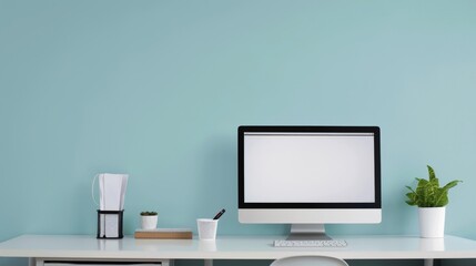 A man sits at a desk with a computer monitor in front of him