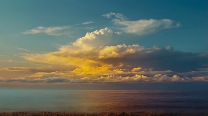 Obraz premium Landscape photography showcasing a vast expanse of rolling hills under a dramatic sky features vibrant yellow shrubs, contrasting with the cooler tones of the surrounding vegetation