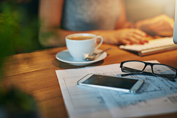 Blueprint, phone and architect on desk with glasses, coffee or woman typing on keyboard at night. Engineer, paper or drawing for building design, floor plan or construction sketch for office deadline