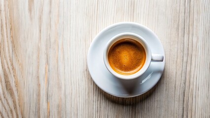 Fototapeta premium Cup of aromatic coffee standing on an empty table. View from above, outdoor, close-up. Vacation and travel concept