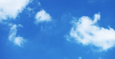 Pure White Clouds Floating on Vivid Blue Sky