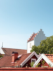 Fototapeta premium Wooden houses and the church tower in the small town of Kristianopel, Blekinge, Sweden