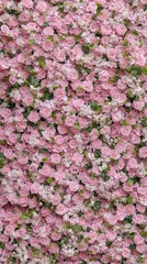 A delightful arrangement of pink roses and green leaves creates a stunning visual of nature's elegance and vibrant color palette