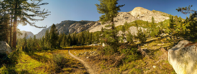 A mountain range with a path leading to it