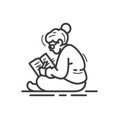 Person Reading a Book While Seated on the Floor