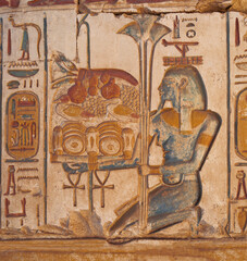 colorful wall reliefs represents an offering of food  to the Gods in the Temple of Ramesses II at Abydos. 