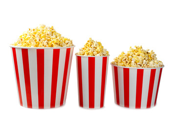 Popcorn box. Red and white striped buckets of salted popcorn isolated on white background. Cinema and entertainment concept. Movie night with popcorn. Delicious appetizer, snack.