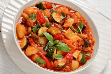 hearty italian vegetable stew in bowl, top view