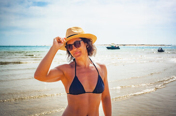 woman in bikini on the beach in Algarve