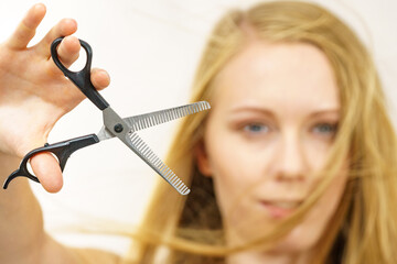 Girl with scissors thinning shears