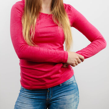 Woman chest, pink blouse and long hair