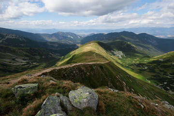 Krupova hola, Nizke Tatry, Low Tatras, Slovakia. Beautfiul landscape summer scenery of mountains and valley. Summer with cloud sky. Steep hillside and cliff. © M-SUR