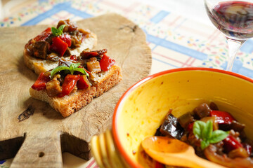 Homemade Sicilian caponata bruschetta made with Italian eggplant and red peppers