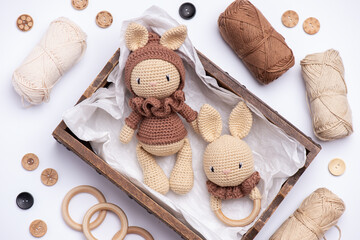 Handmade knitted amigurumi bunny toy on a white background.