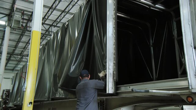 Man open Conestoga type Trailer