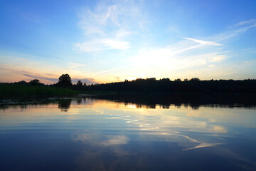 Sunset on the lake. Amazing sunset over the river. Sunset landscape.
