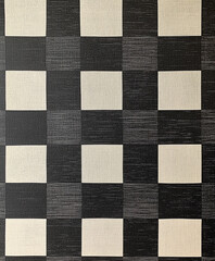Fototapeta premium checkerboard pattern with alternating black and white squares, giving a timeless and clean look. The design includes a slight sheen on the black squares and a subtle texture to enhance the pattern’s
