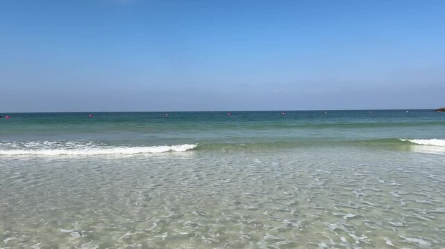 Sea surf. Al Mamzar beach, Dubai. Calm sea.