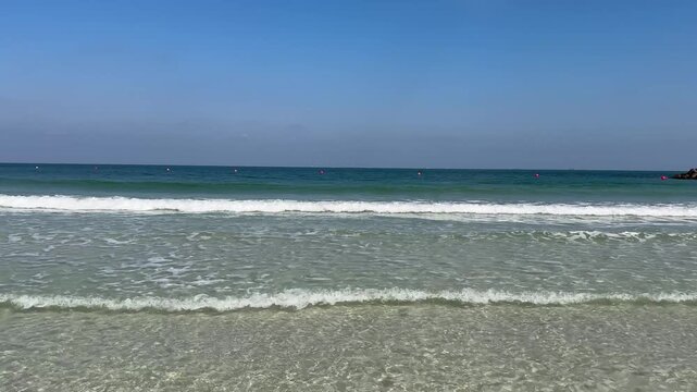 Sea surf. Al Mamzar beach, Dubai. Calm sea.