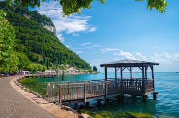 Wooden gazebo at the shore of the lake in the touristic Place of Garda, Italy