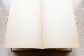 Empty endpaper antique book on marble table, old paper texture, rustic blank space, glimpse past, advt blackboard, vintage paper menu, background for designer