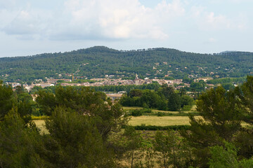 Obraz premium A Verdant View of the French Countryside, Beneath the Sunny Skies of Summer