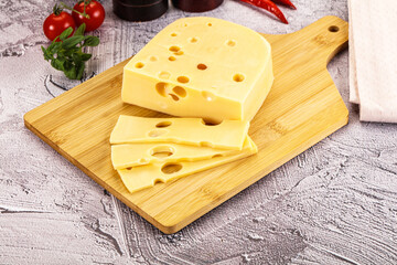 Maasdam cheese piece with slices