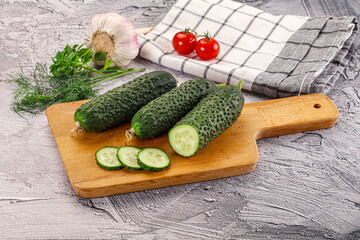 Raw green cucumbers with slices