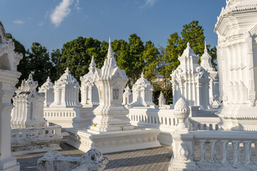 a grouping of whitewashed mausoleums, which house the cremation ashes of members of the royal family of Chiang Mai in Wat Suan Dok, Chiang Mai, Thailand