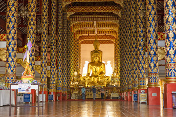 Buddha statues covered with gold leaf inside the Wat Suan Dok, Chiang Mai, Thailand