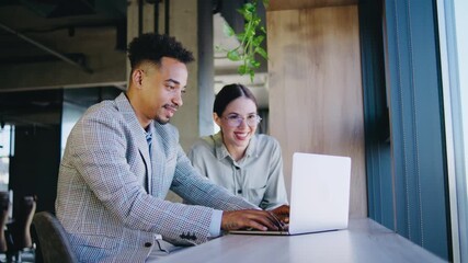 In a modern office setting, collaborative working flourishes as diverse professionals engage in meaningful discussions, exchanging ideas and strategies to foster innovation and efficiency